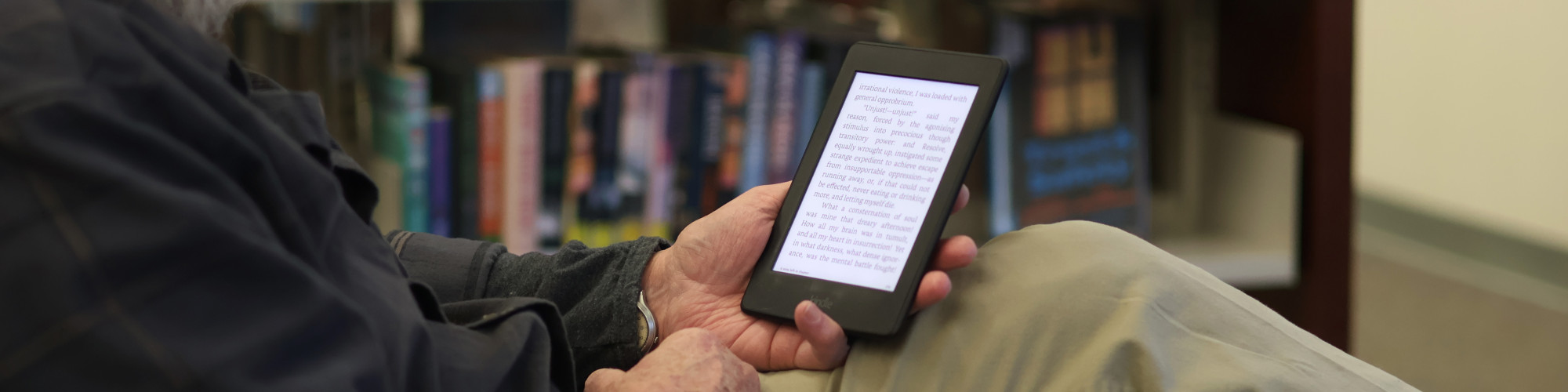 Person reading Kindle