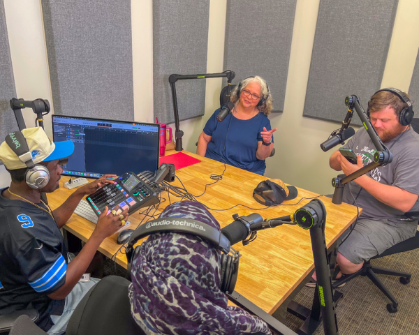 Customers record in the new podcast studio, located in the Digital Studio at Northside Branch.